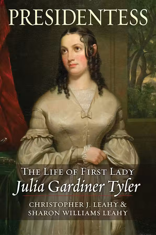 The cover of a book titled Presidents: The Life of First Lady Julia Gardiner Tyler by Christopher J. Leahy and Sharon Williams Leahy. The cover features a painted portrait of Julia Gardiner Tyler in a long, light-colored dress, standing against a dark interior and wooded background.