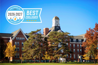 A bright autumn view of a red-brick college building with a prominent white cupola and surrounding trees in fall colors. A graphic in the upper-left corner reads “Colleges of Distinction 2026–2027” and “Best Colleges,” with five gold stars.